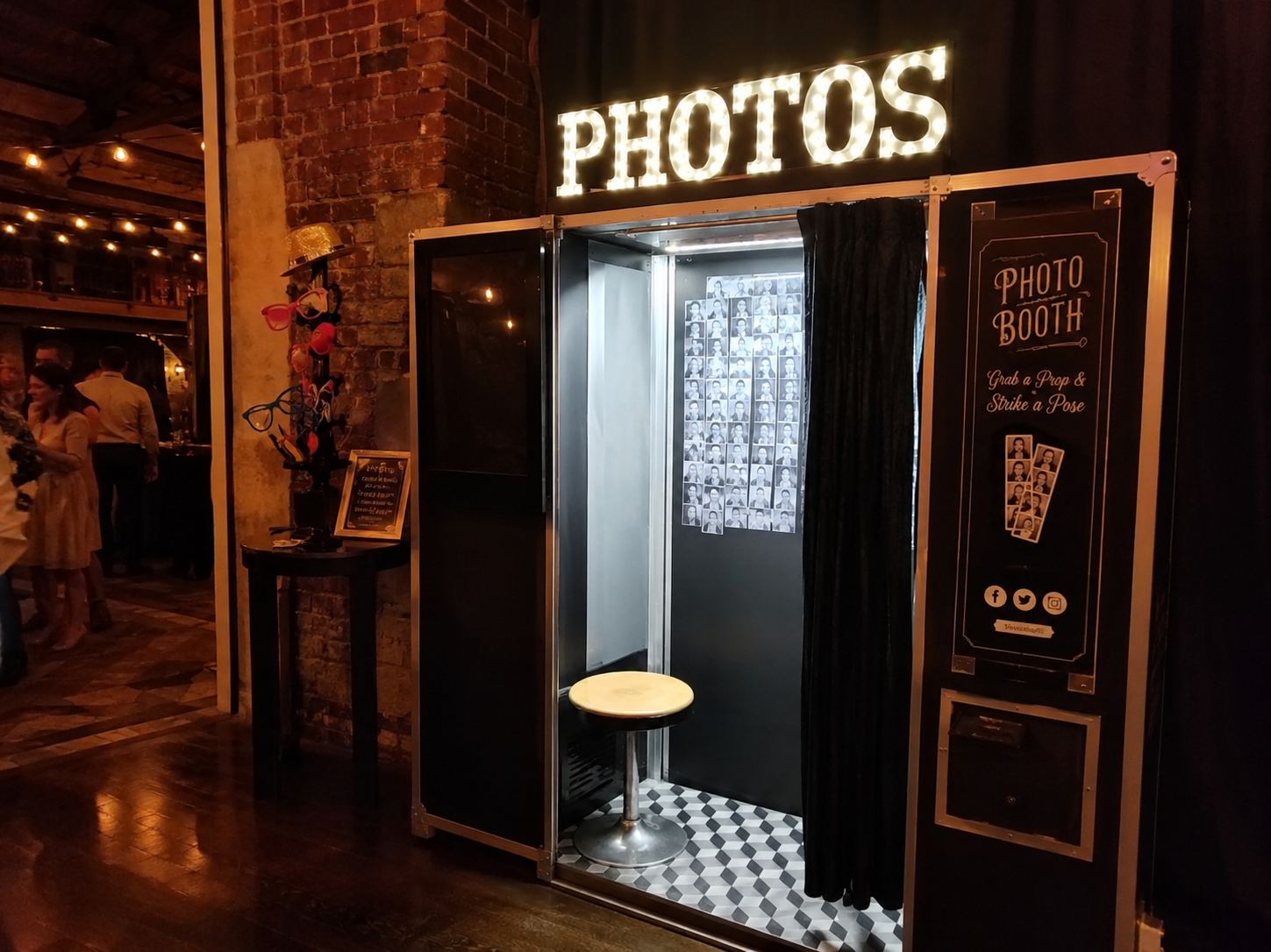 party photo booth with lit sign and props in Pharr, TX