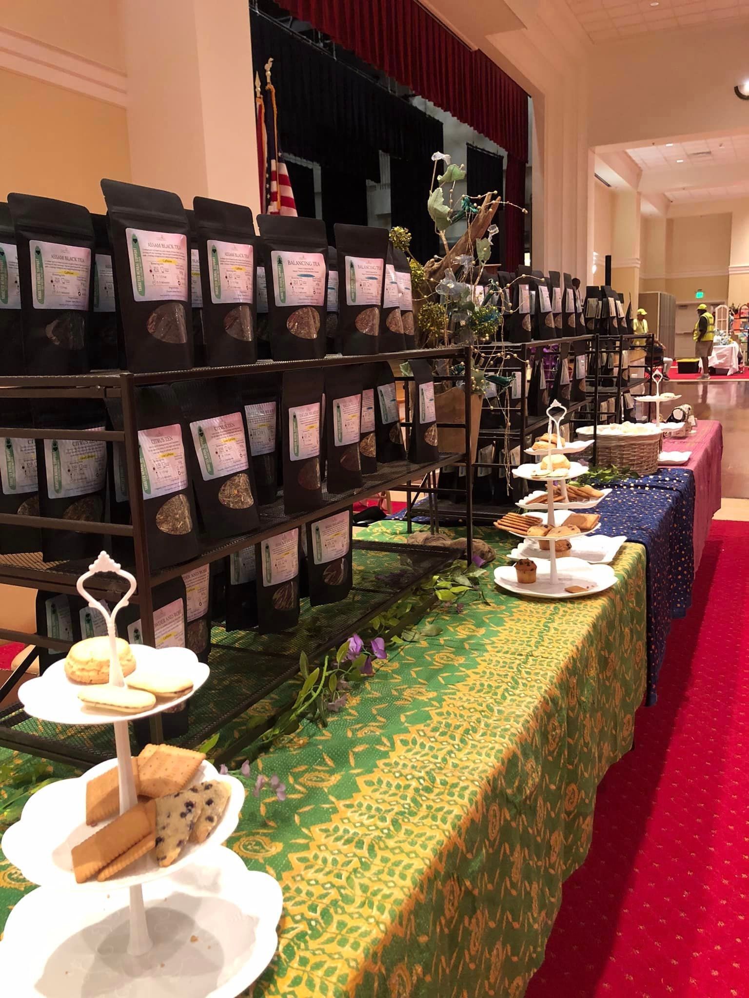A long table with a lot of food on it in a room.