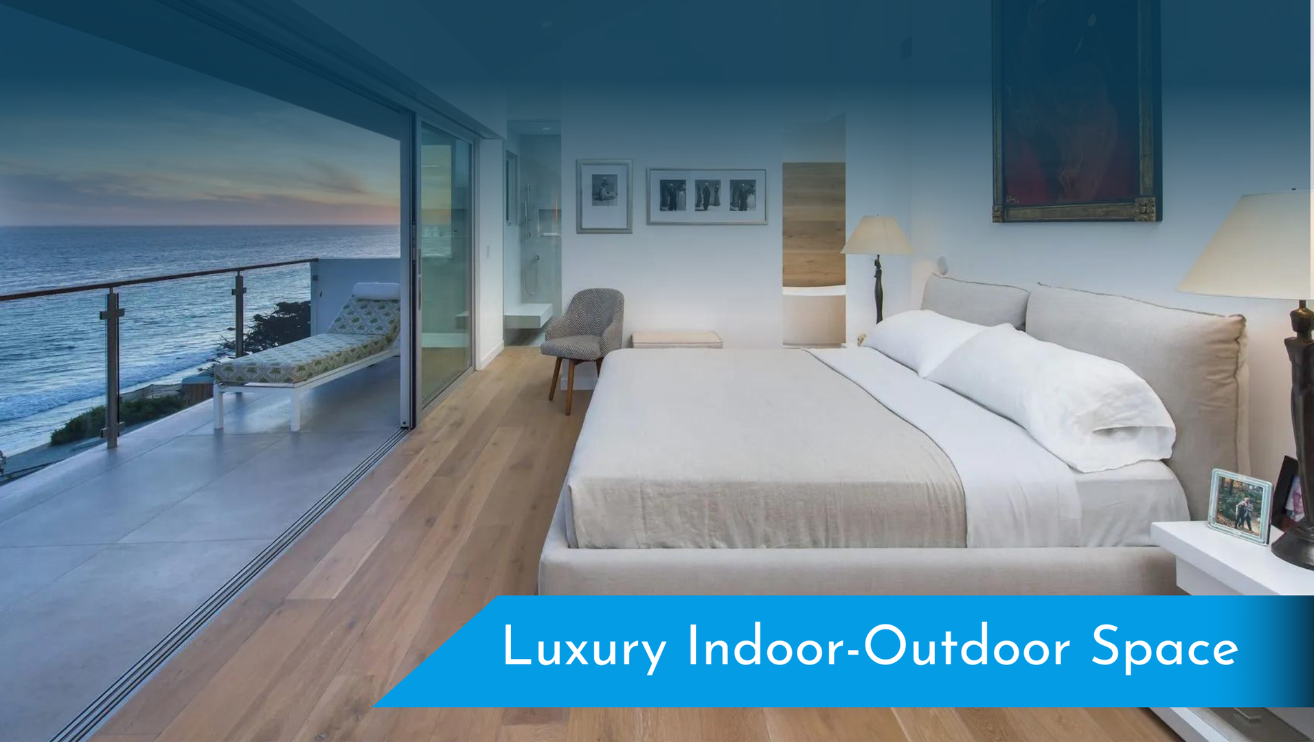 A bedroom with a large bed and a balcony overlooking the ocean.
