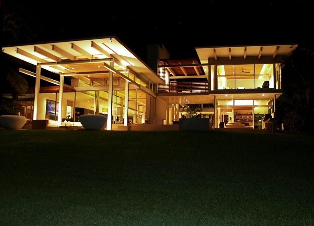 The Makena Modern residence in Maui, HI lit up at night