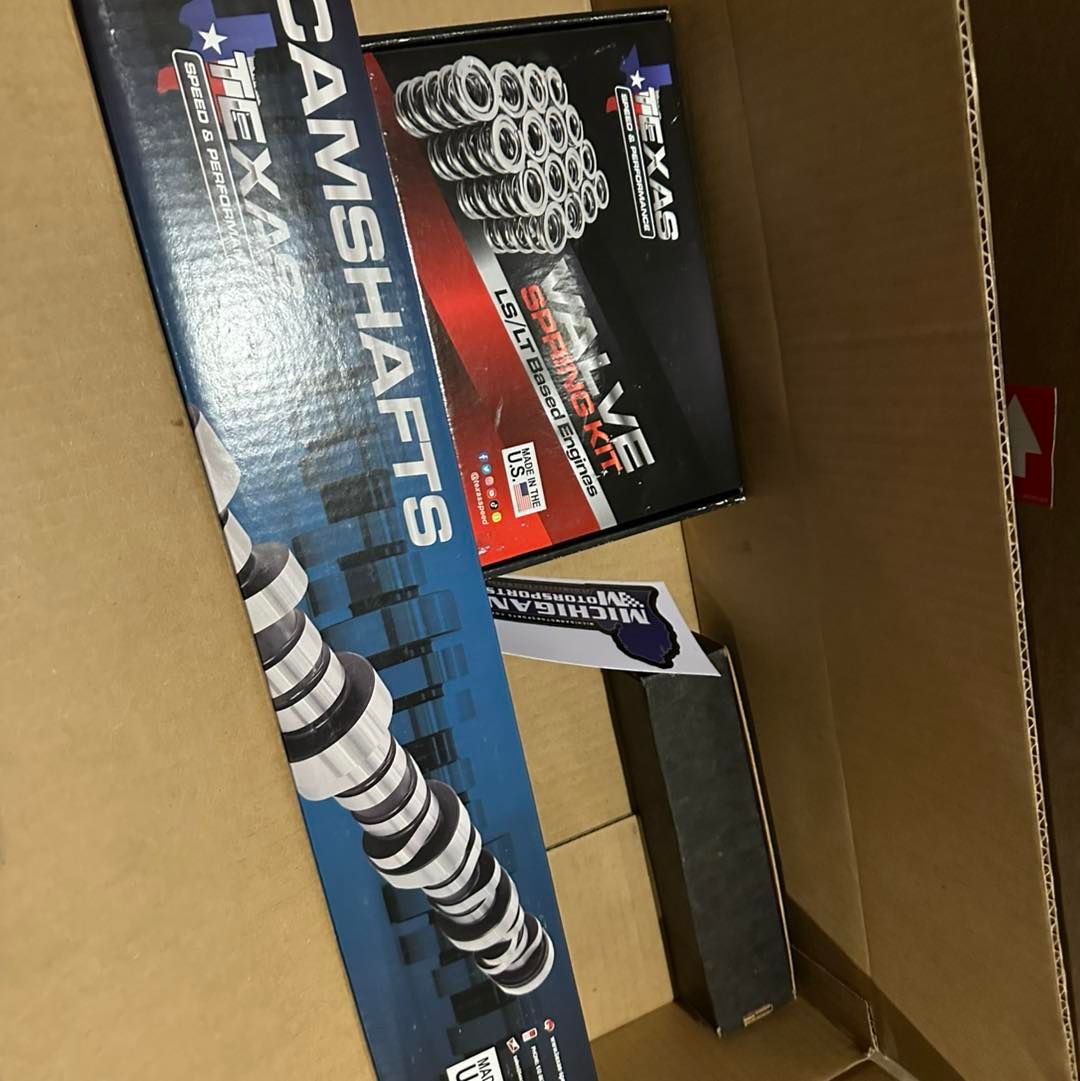 Texas Speed & Performance camshaft and valve spring kit boxes inside a cardboard shipping container.
