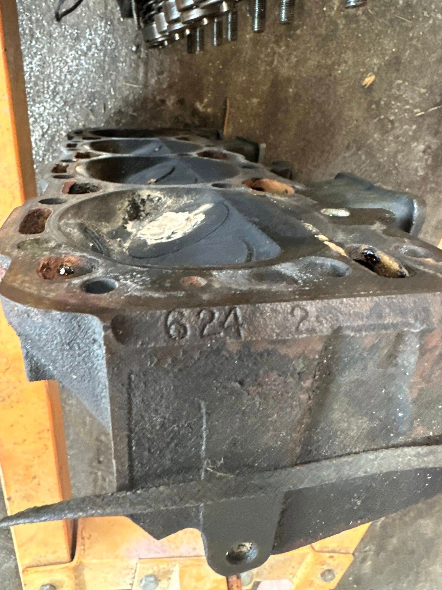 A cast iron cylinder head with the number 