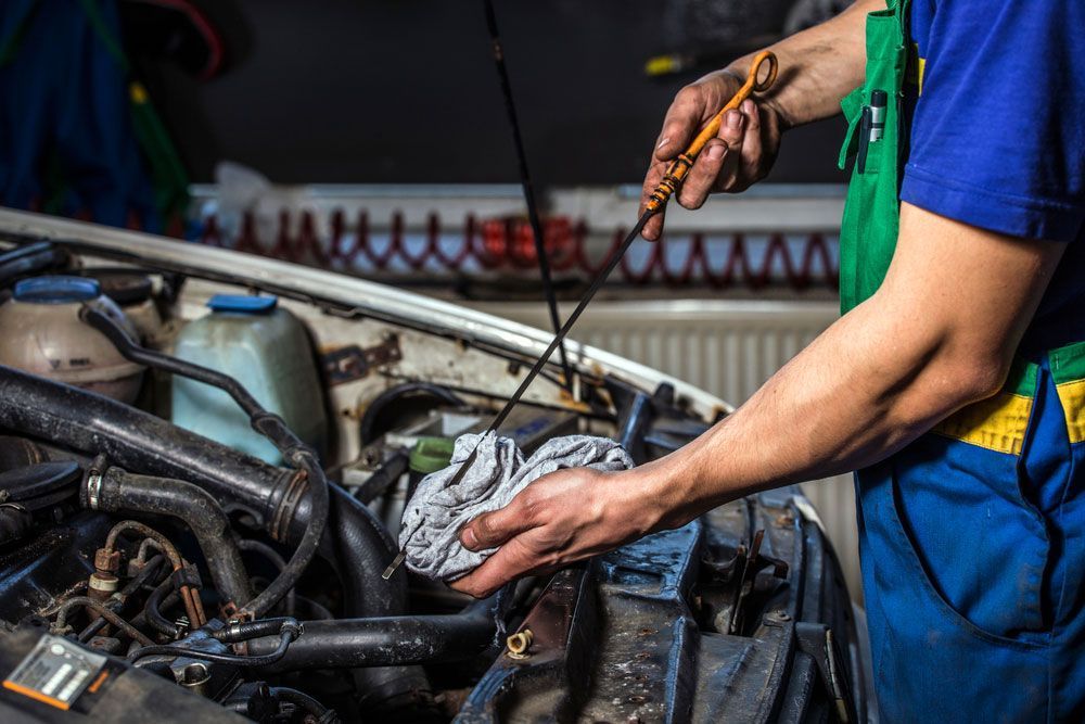 Mechanic Changing a Car's Engine Oil — Northern Service Centre in Westcourt, QLD
