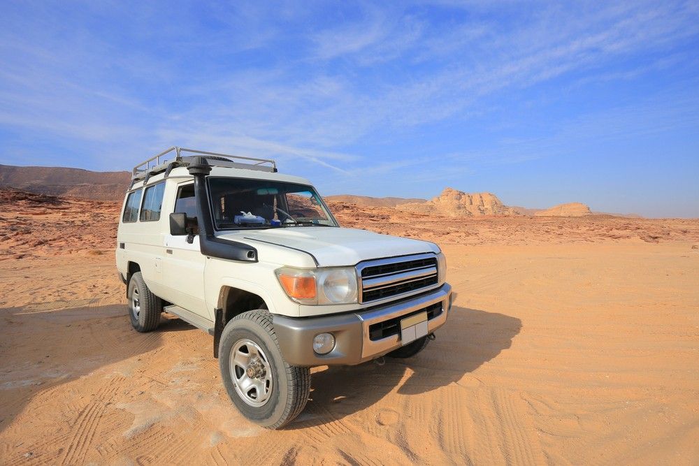 A White Suv is Parked in the Middle of a Desert — Northern Service Centre in Westcourt, QLD