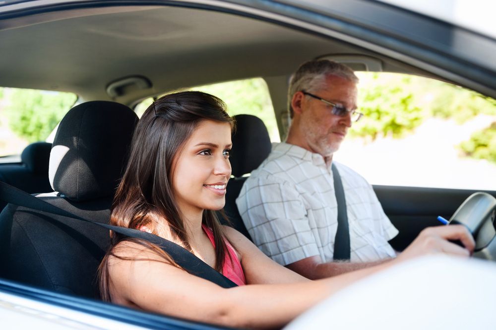 Man Teaching Woman to Drive — Start Learning Automotive in Sydney, NSW