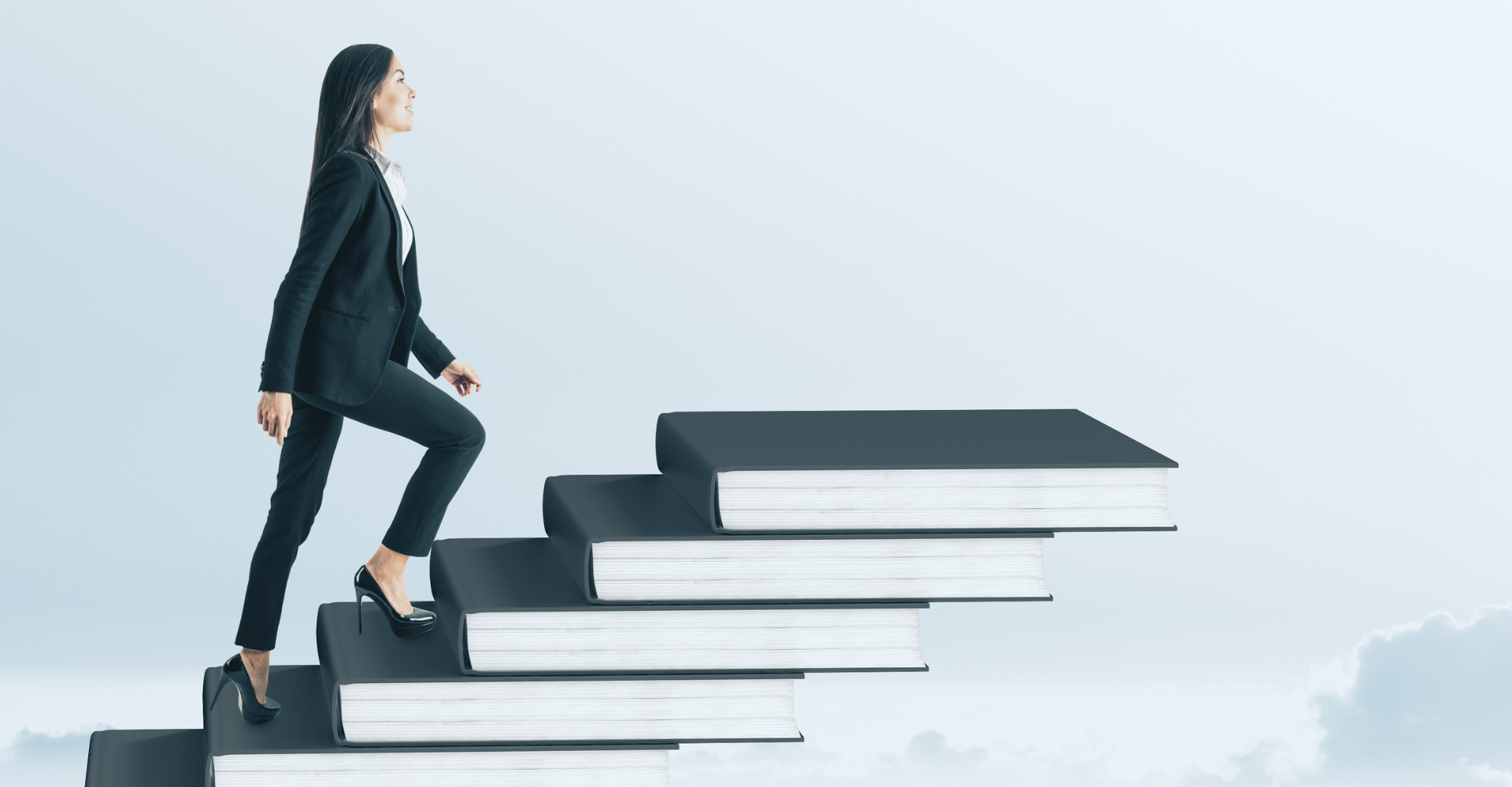 A woman in a business suit climbs stairs made of large books, symbolizing personal growth and career advancement.
