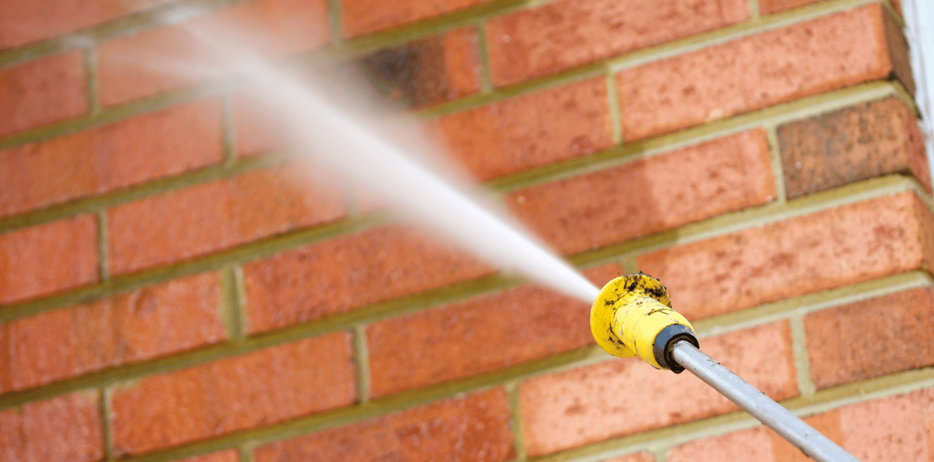 Cleaning a brick wall