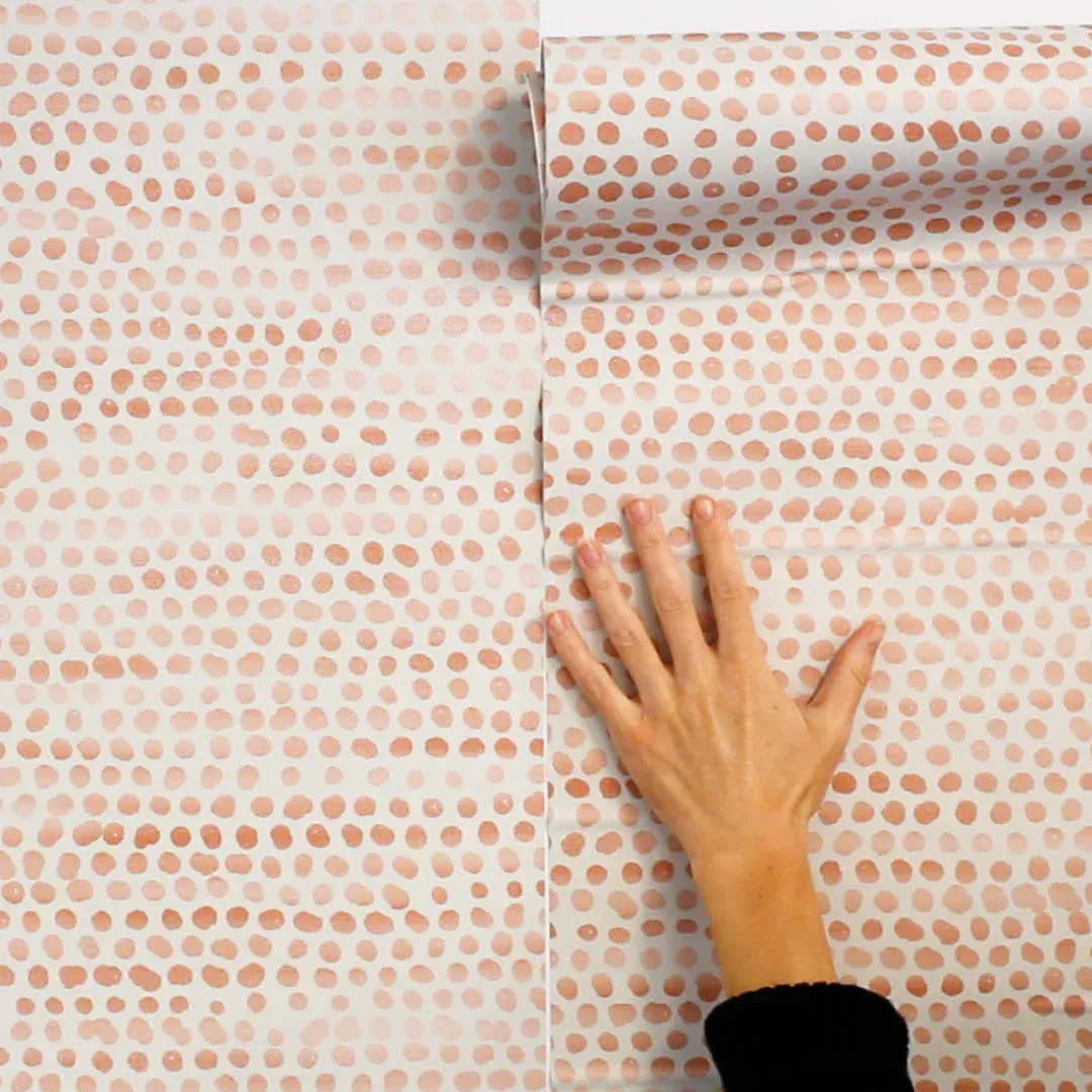 Matching the grain of rolls of wallpaper