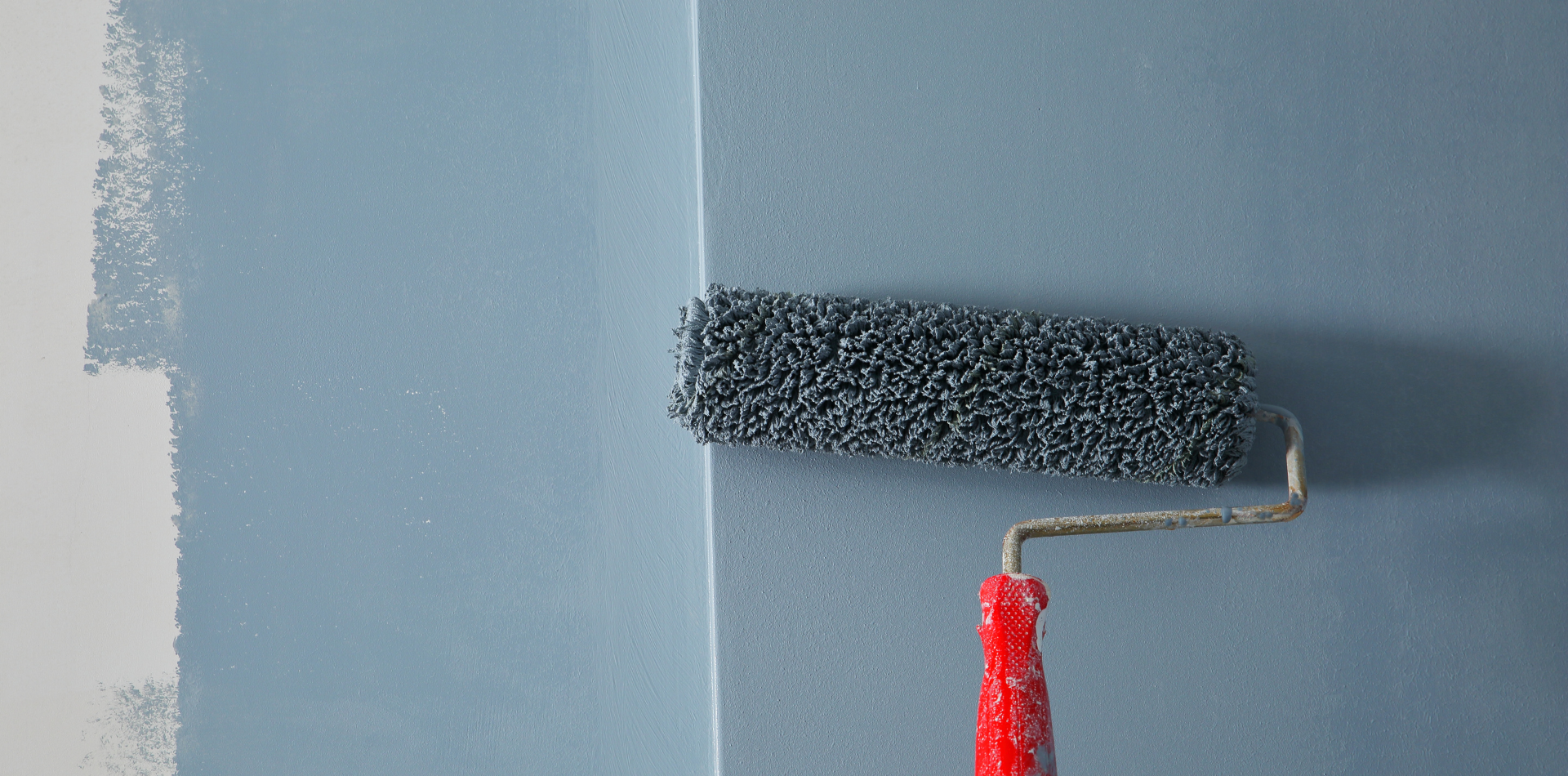 painting a driveway with grey paint