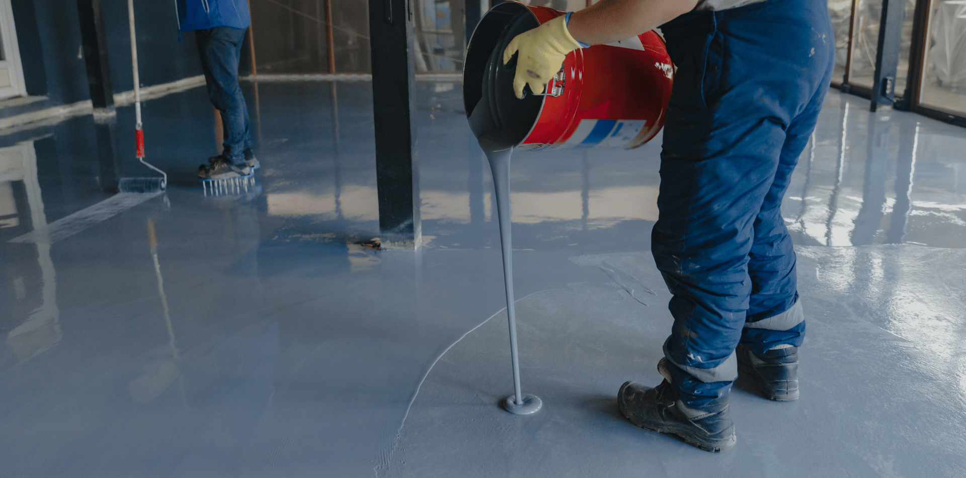 Professional Painter installing Epoxy Floor