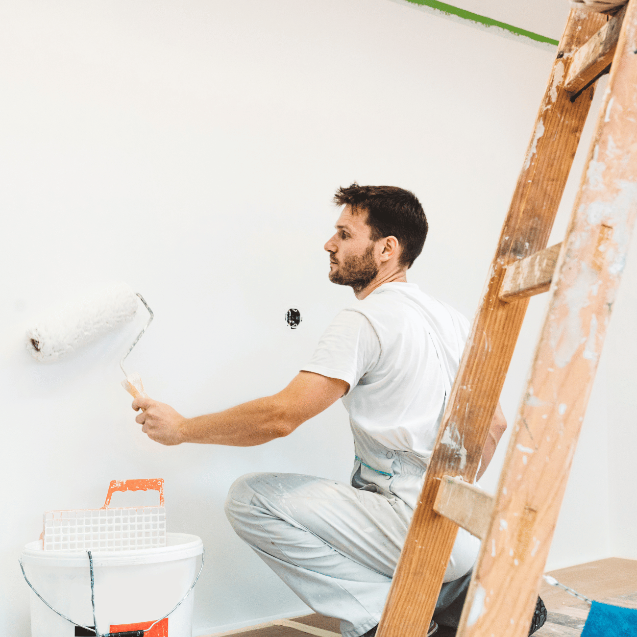 Professional Painter rollong a wall