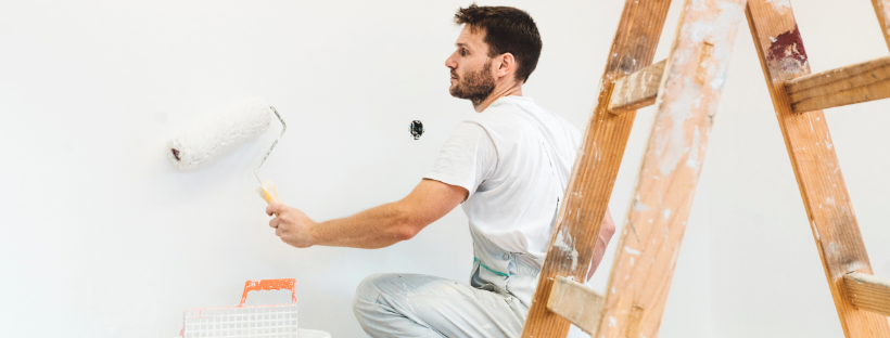 professional painter rolling a wall
