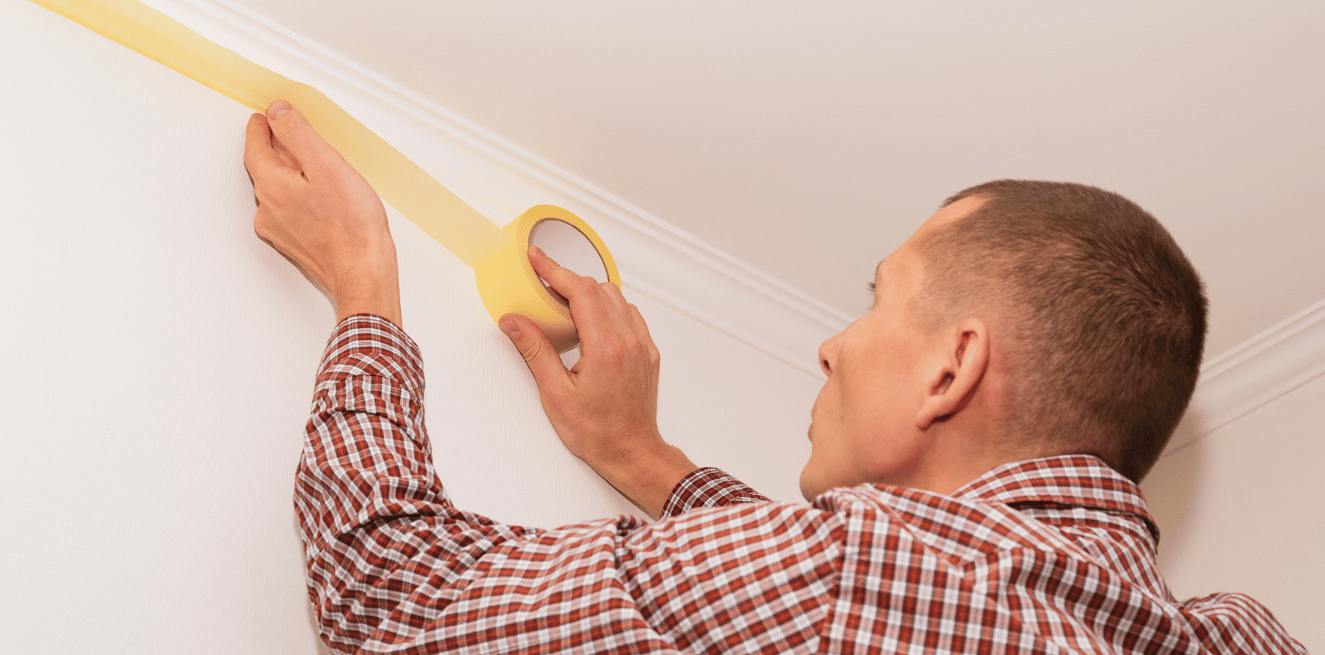 Taping a wall ready for painting