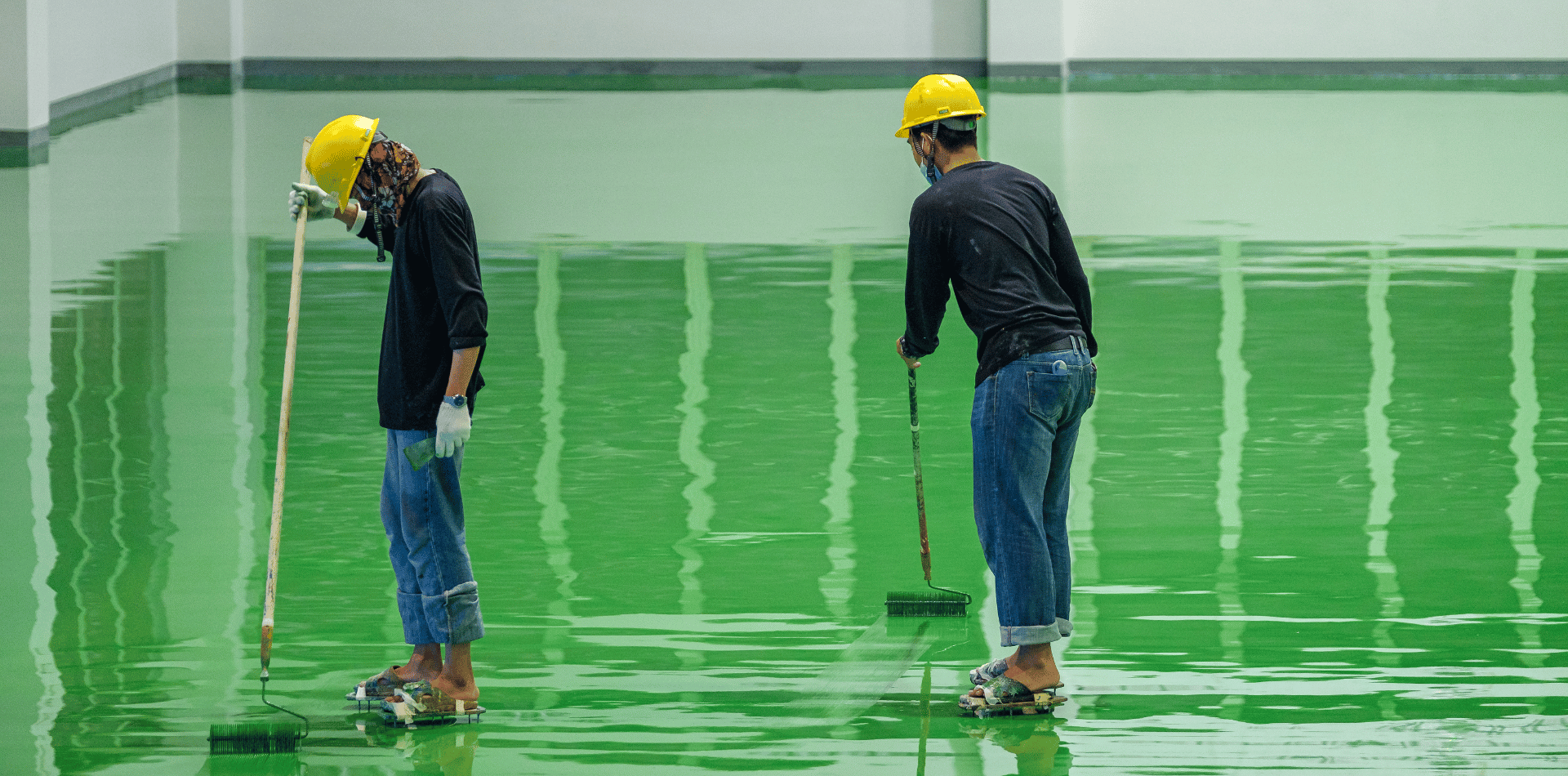 two men installing Epoxy flooring