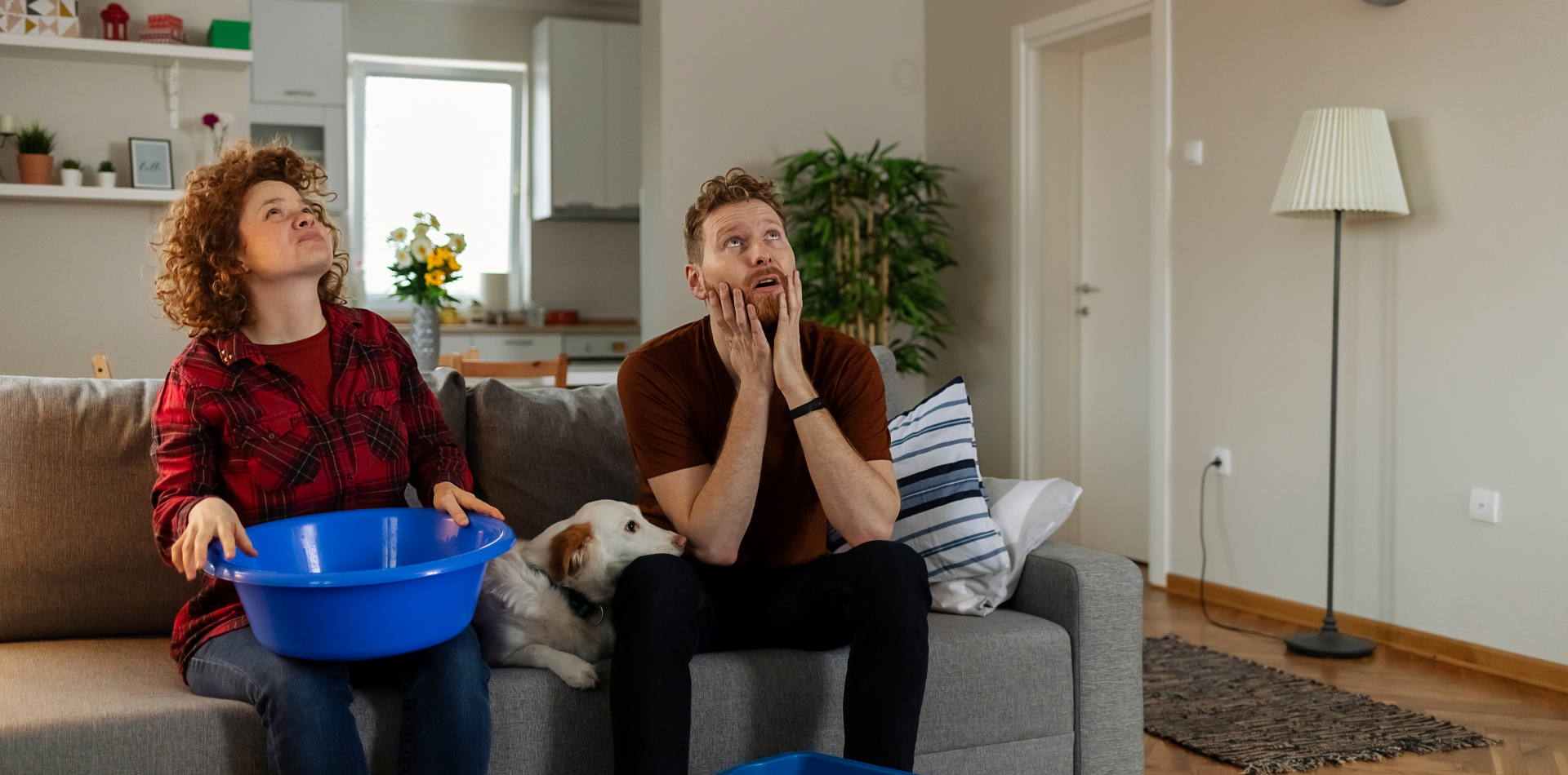 people sitting in a room with a leaking roof