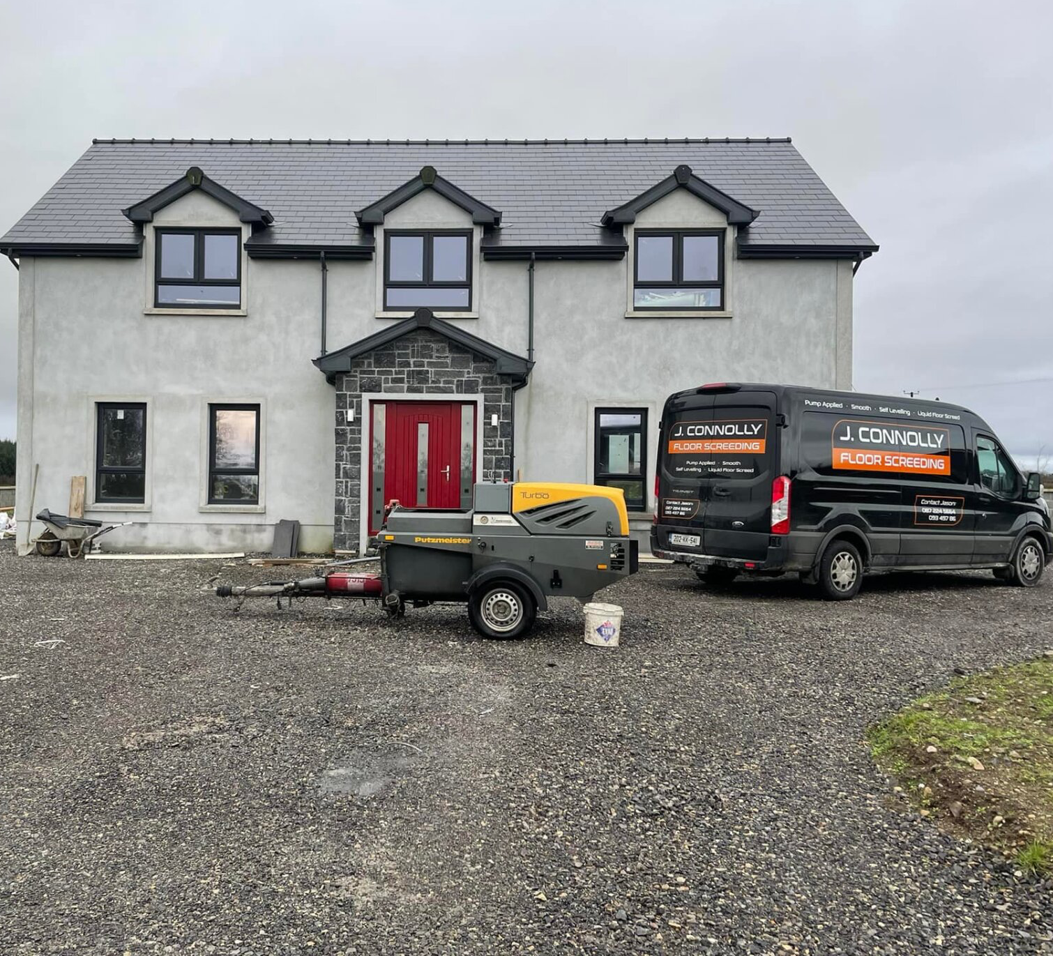 A large house with a van parked in front of it.