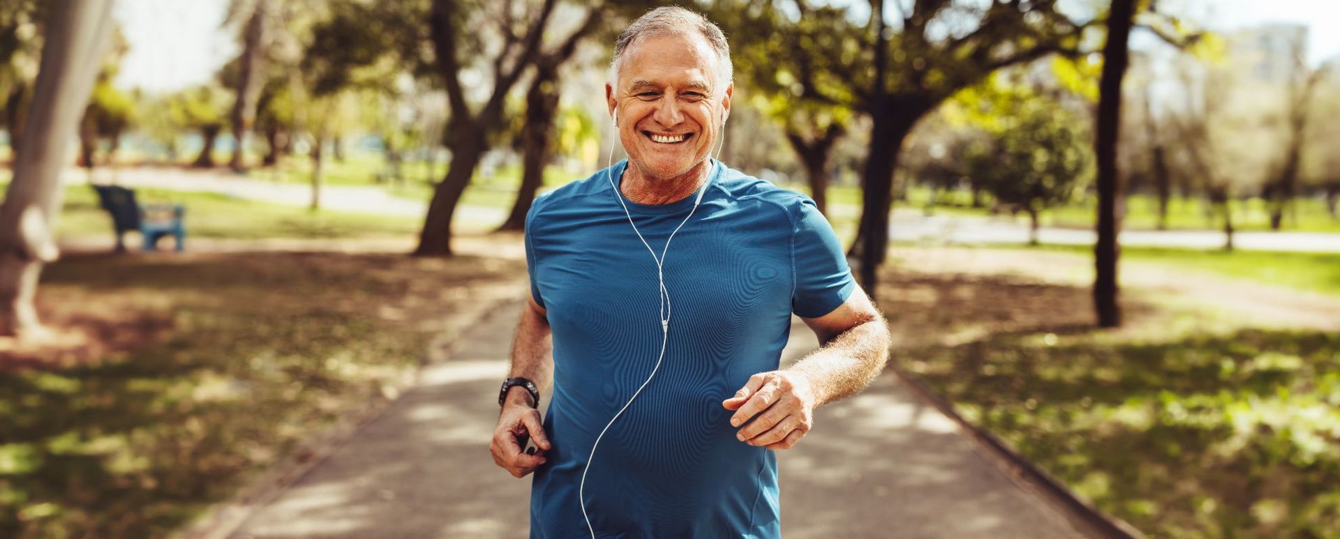 senior man jogging in park