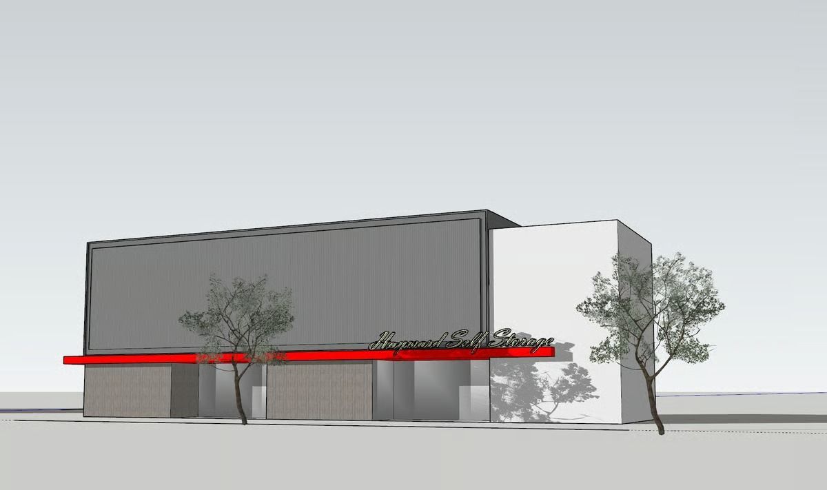 A 3D architectural rendering of a modern building with a grey facade, white side section, red awning, and two trees.