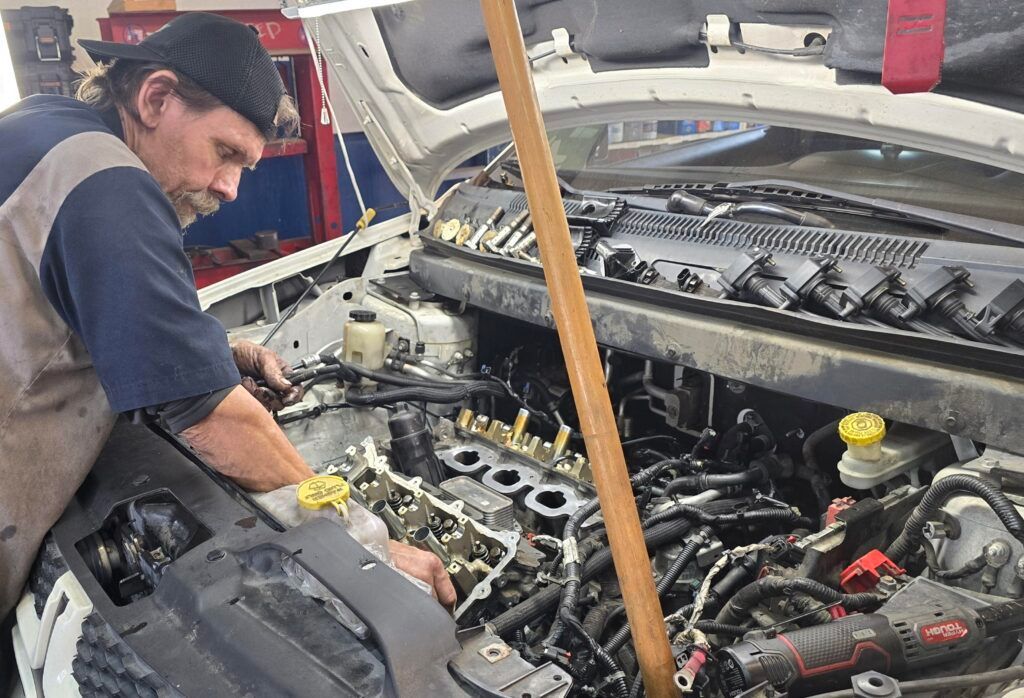Mechanic Performing Engine Repair | Advanced Tire & Auto Service