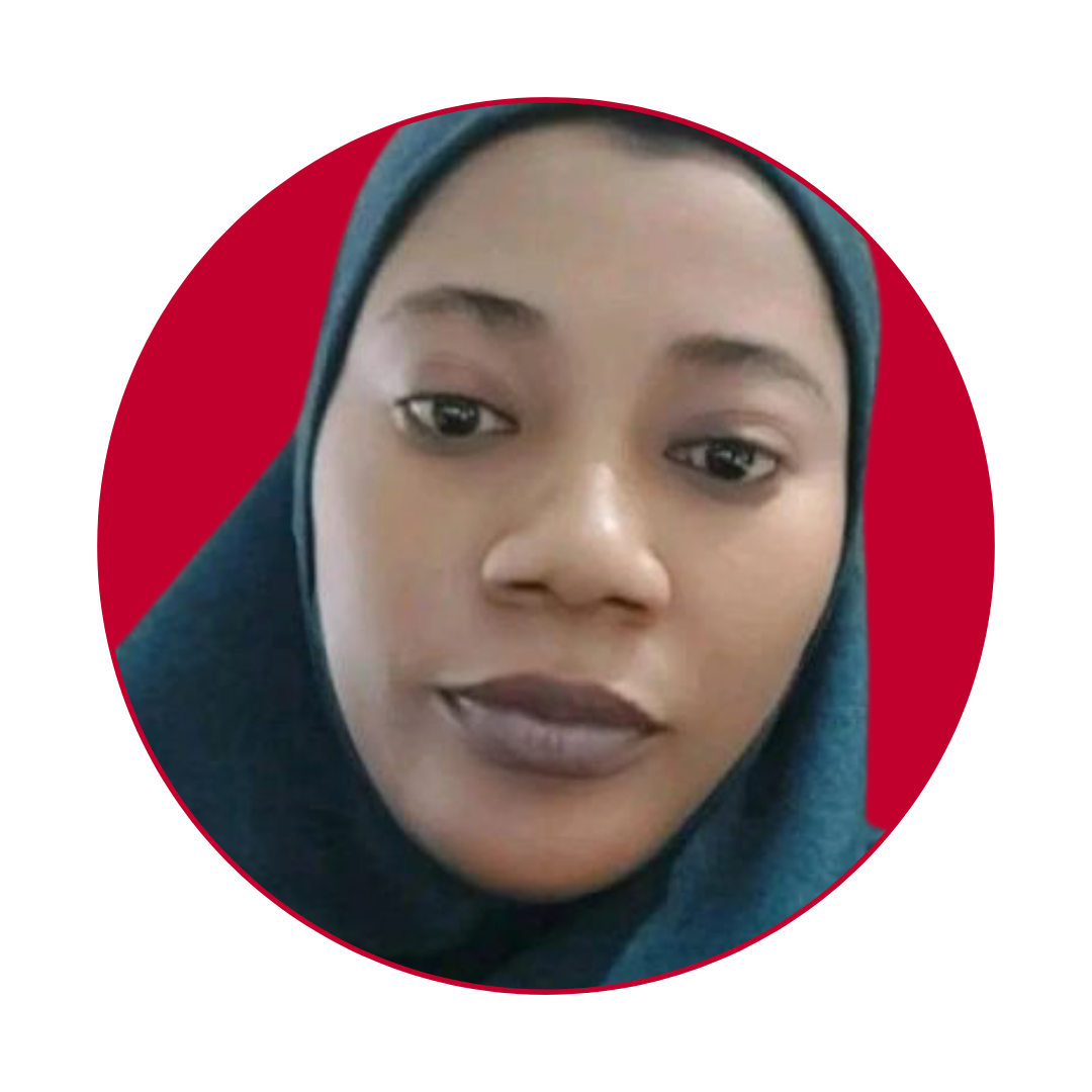 A woman wearing a blue hijab is looking at the camera.