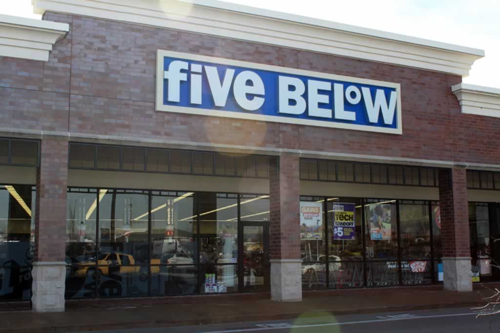 A five below store is located in a brick building