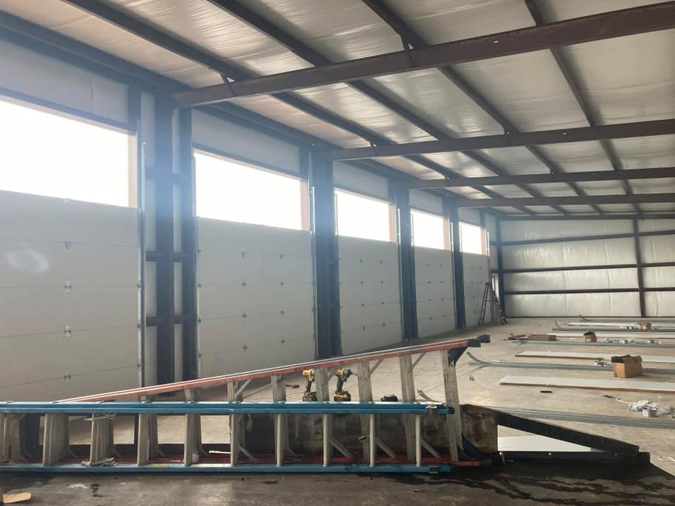 Step Ladder Lying Down On Warehouse — Denison, TX — North Central Door and Gate