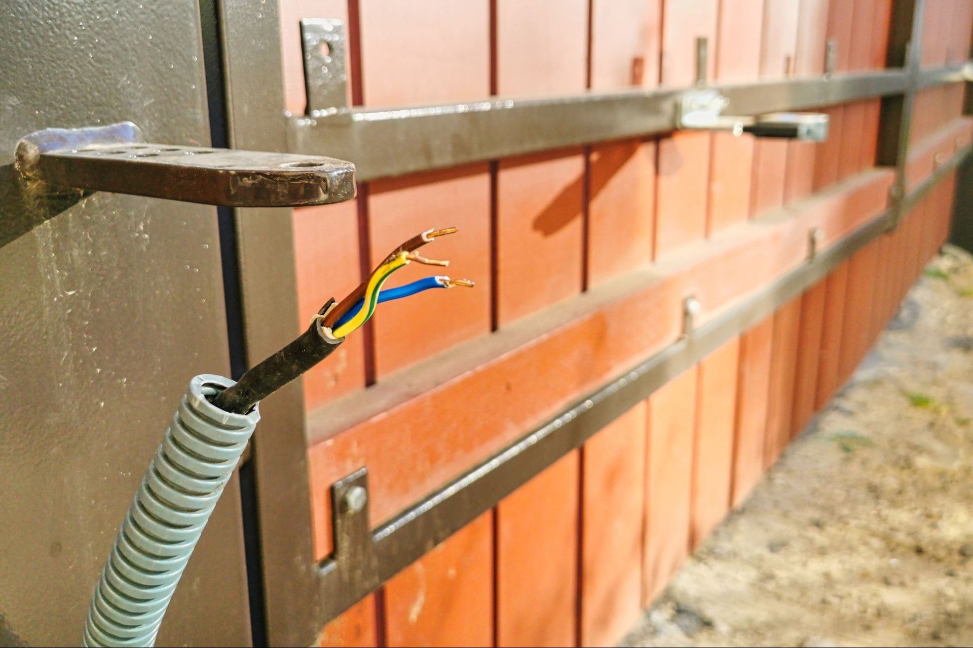 Broken Wire Attached to A Wooden Fence — Denison, TX — North Central Door and Gate