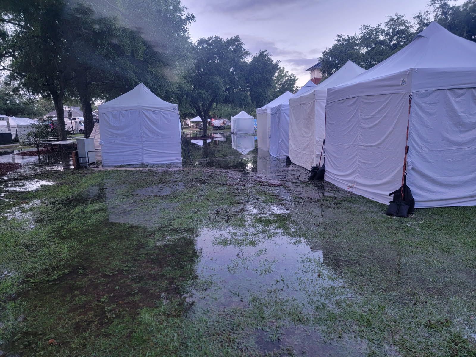 Water covers areas of John. B. Foley Park just before the start of the 2025 Art in the Park festival.