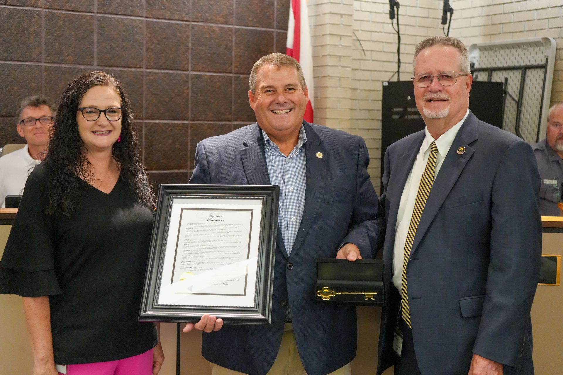 Foley Mayor Ralph Hellmich, right, presents Alabama Commissioner of Conservation and Natural Resourc