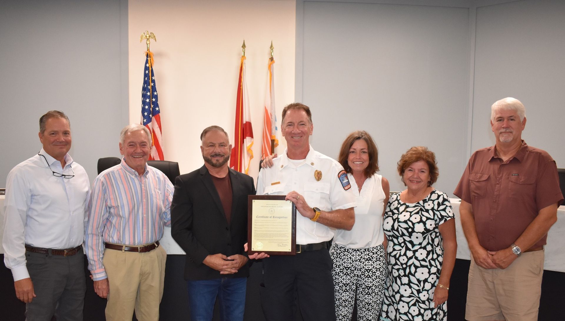 In the photo, from left, are Chairman Pro-Tem Jeff Boyd, Councilman Jerry Johnson, Mayor Tony Kennon, Chief Kimmerling and his wife Beth, Councilwoman Annette Mitchell, and Councilman Jeff Silvers.