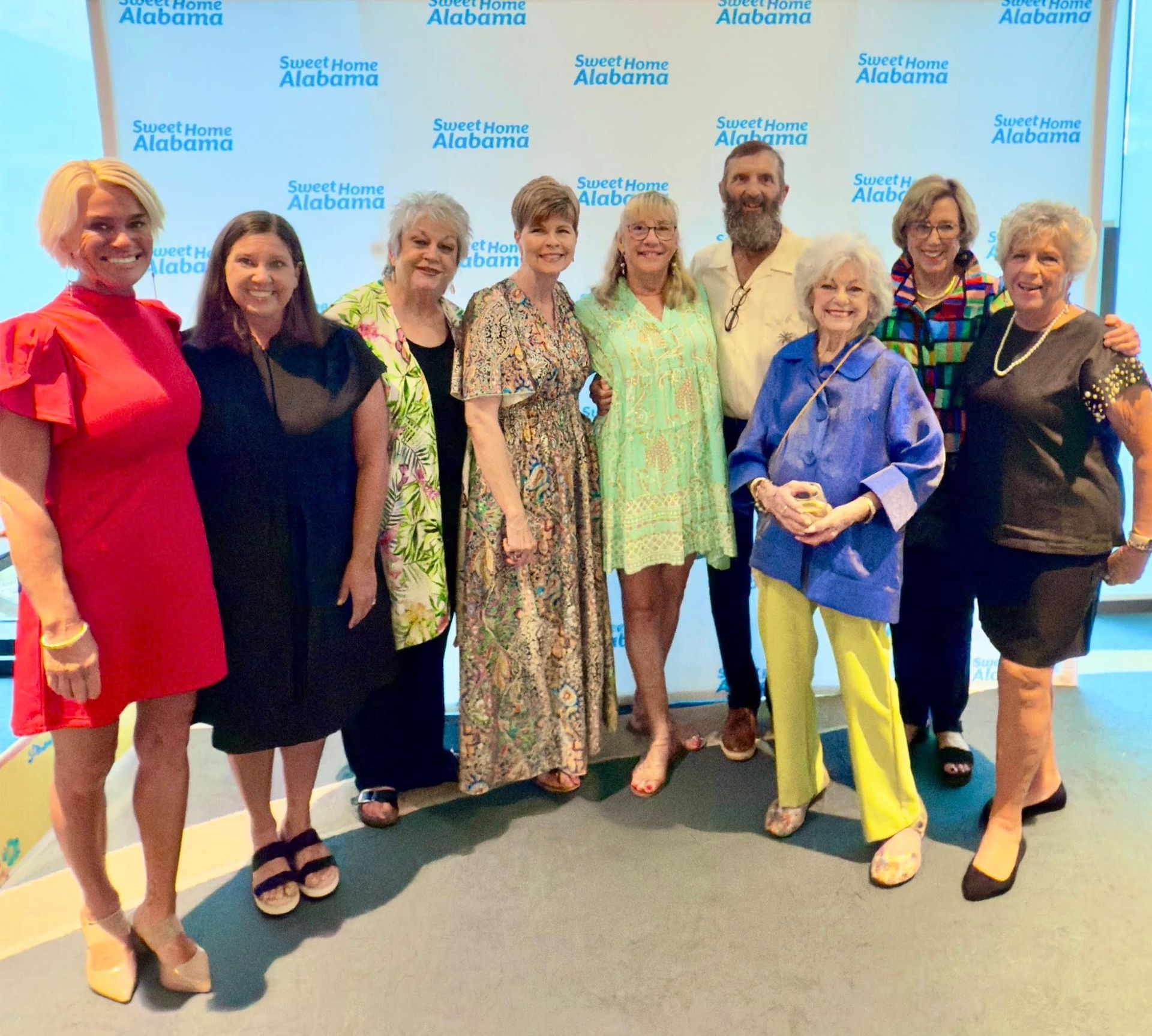 Coastal Art Center Staff: L-R:  Amy DiMario, Brandy Thomley, Vivian Hanich, Desiree Hodge, Dee Burrow, Steve Burrow, Tommie Werneth, Jeanne Duffy, Susan Coyne.