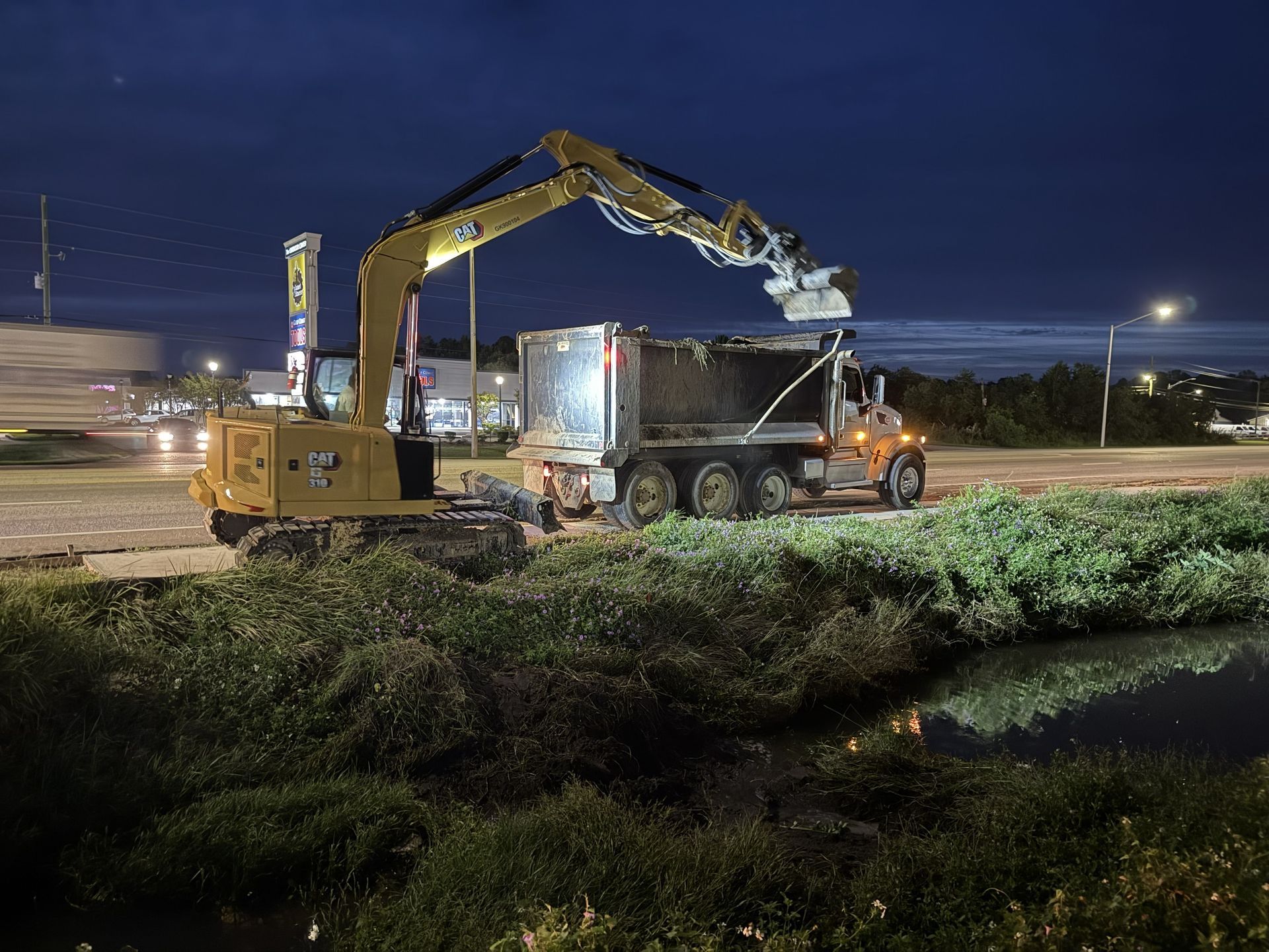Foley Crews Clearing Ditches