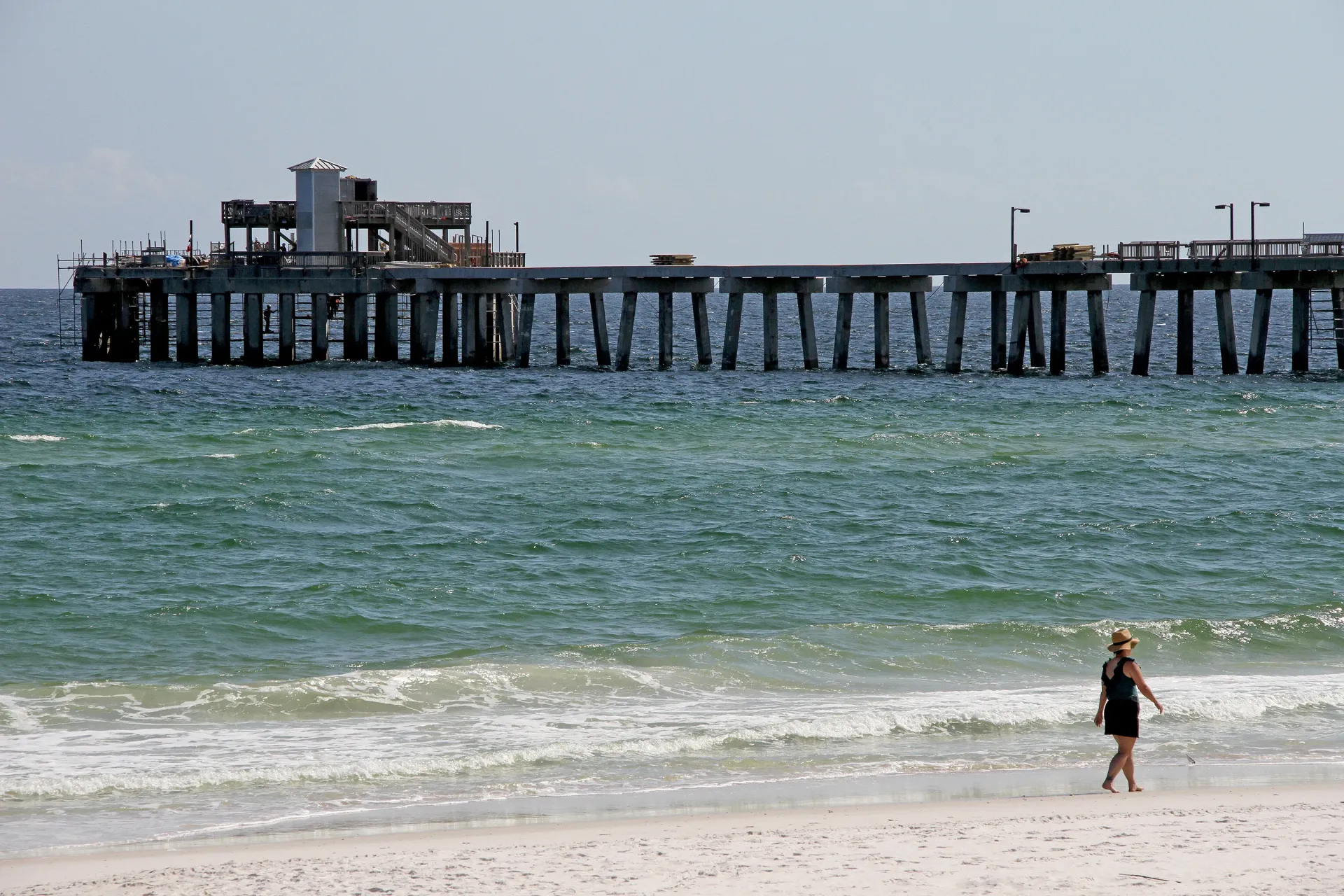 The Gulf State Park Pier missing section has been replaced, allowing workers to reach the octagon without a barge. Photo by David Rainer