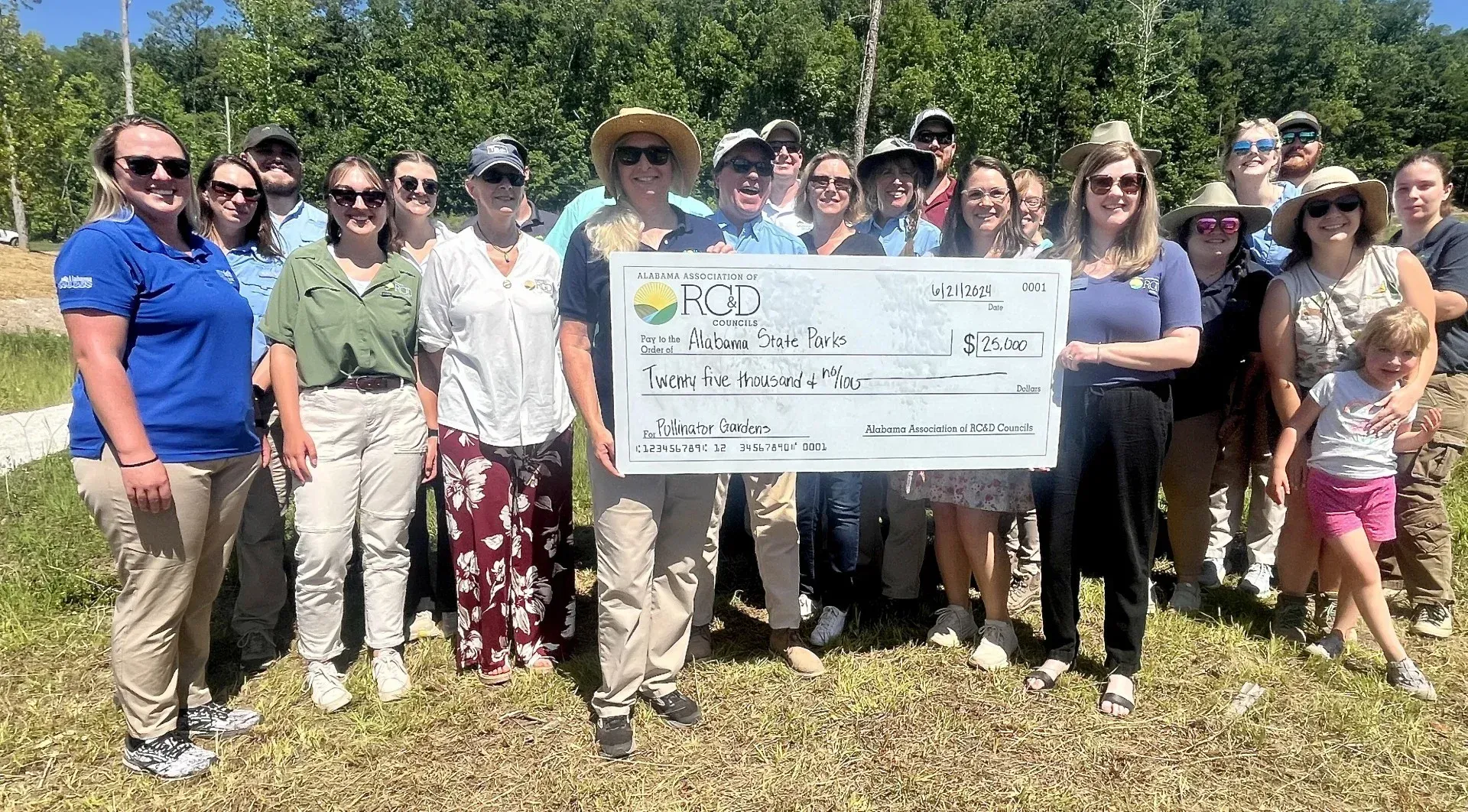 The Alabama Association of Resource, Conservation and Development (RC&D) Councils presented a $25,000 grant to Alabama State Parks on Friday during the Pollinator Festival at Oak Mountain State Park.
