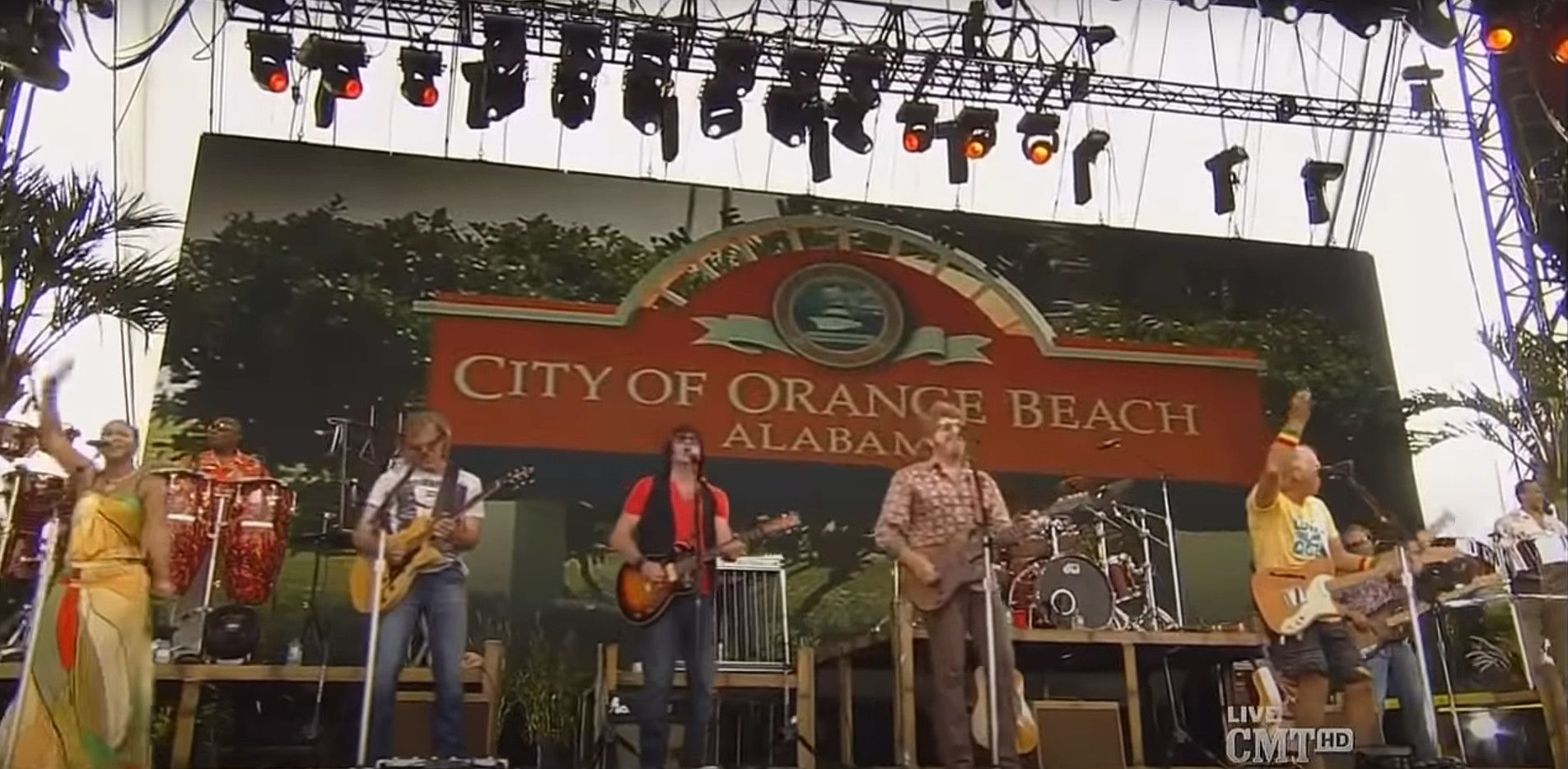Jimmy Buffett's concert on the beach in Gulf Shores in front of the Orange Beach sign