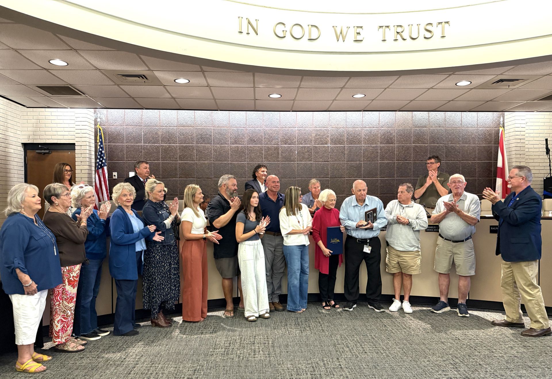 Foley City Councilman Rick Blackwell is joined by family members as he receives a resolution of recognition from Mayor Ralph Hellmich during her last meeting as a council member on Oct. 20. Blackwell served on the City Council since 2008. 
