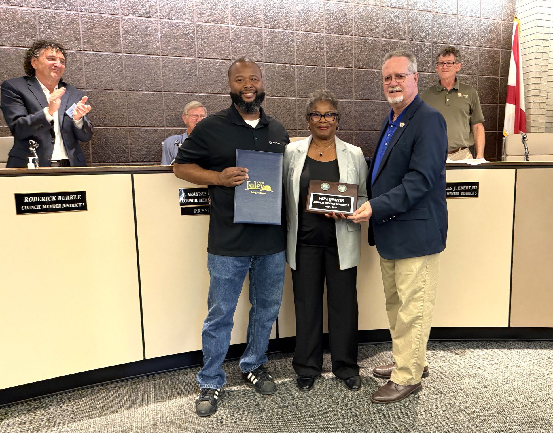 Foley City Councilwoman Vera Quaites receives a resolution of recognition from Mayor Ralph Hellmich during her last meeting as a council member on Oct. 20. Quaites served on the City Council since 2008. 
