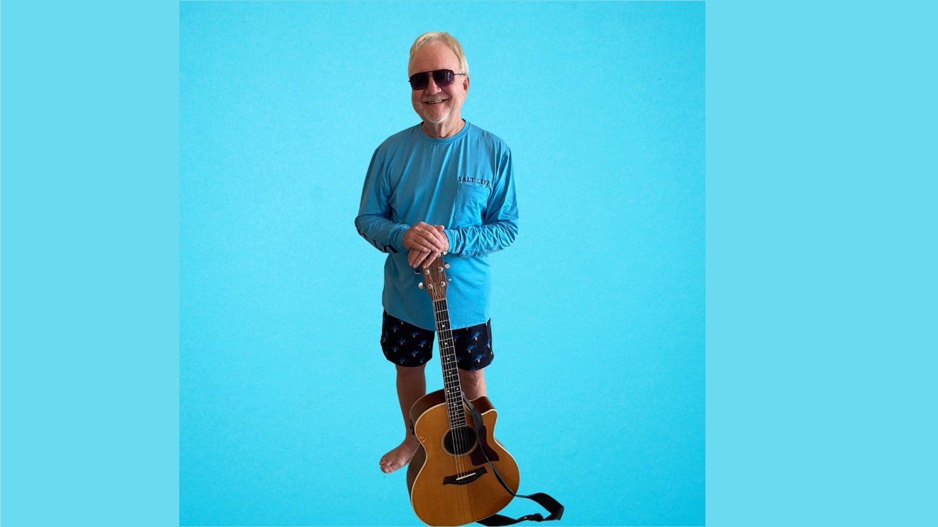 Brent Burns of Gulf Shores, Alabama, right, with music icon Jimmy Buffett.