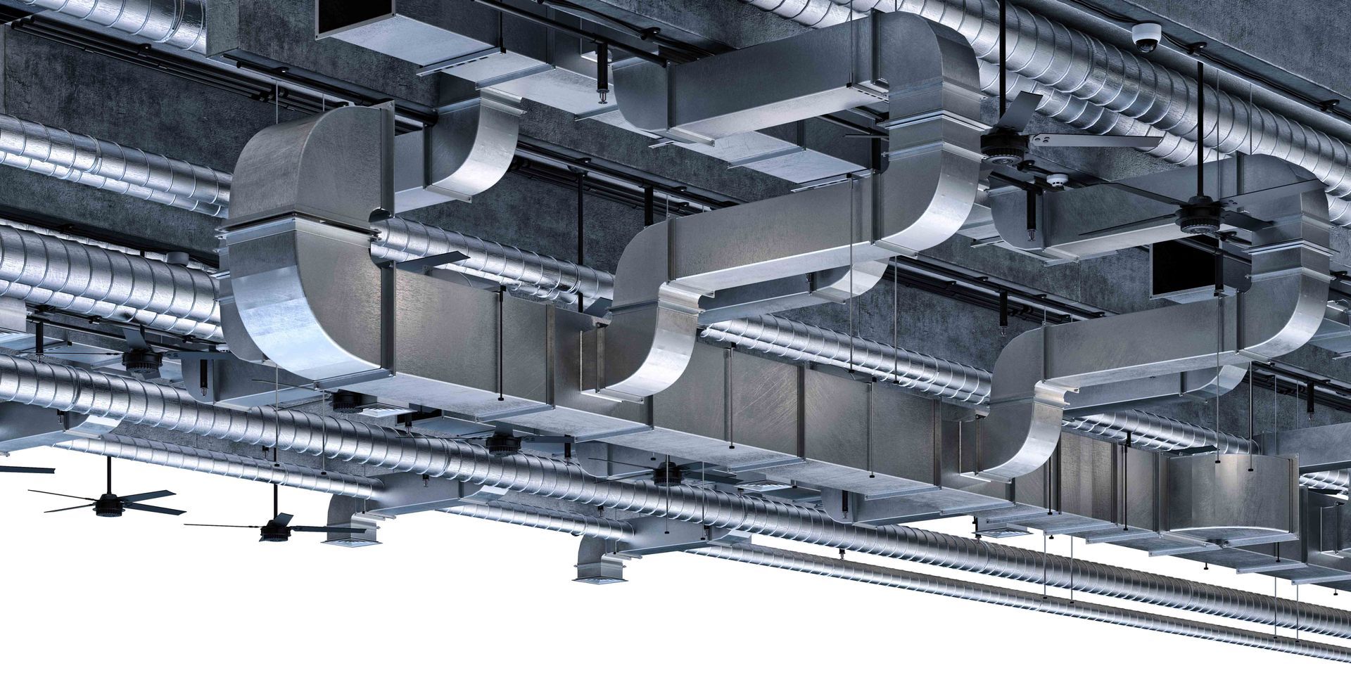 Metal HVAC ductwork installed on a ceiling, gray and silver, with turns and bends.