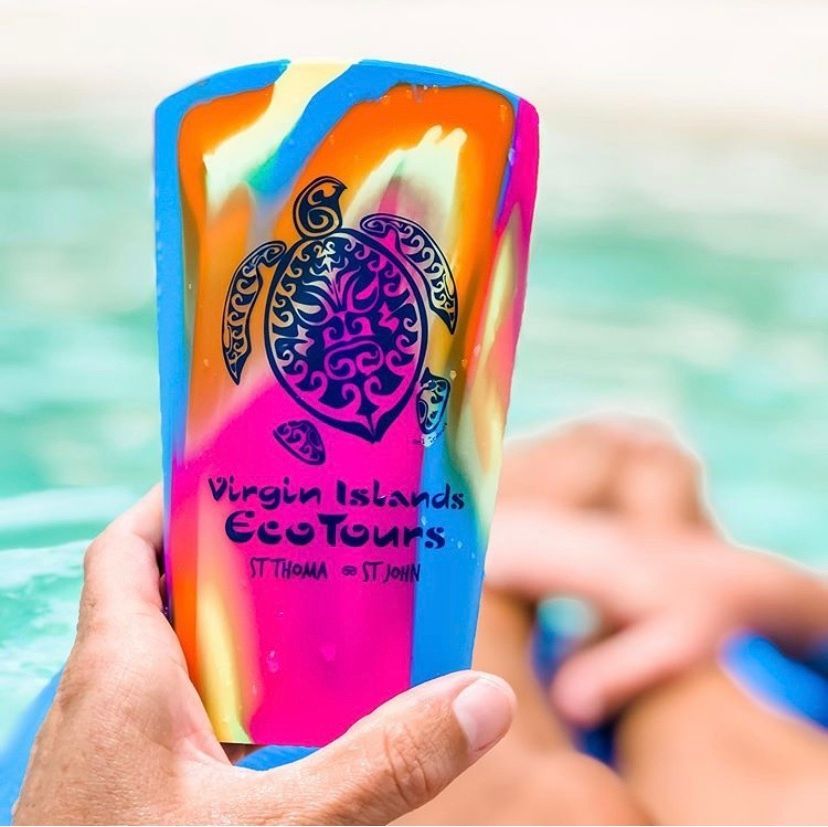 A person is holding a virgin islands eco tours cup