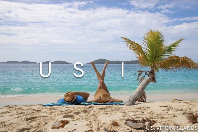 A woman is laying on a beach in the us virgin islands