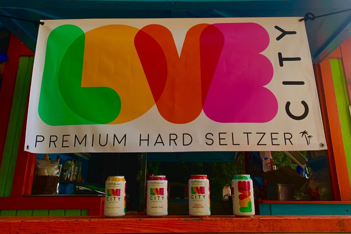 A colorful sign that says love city premium hard seltzer