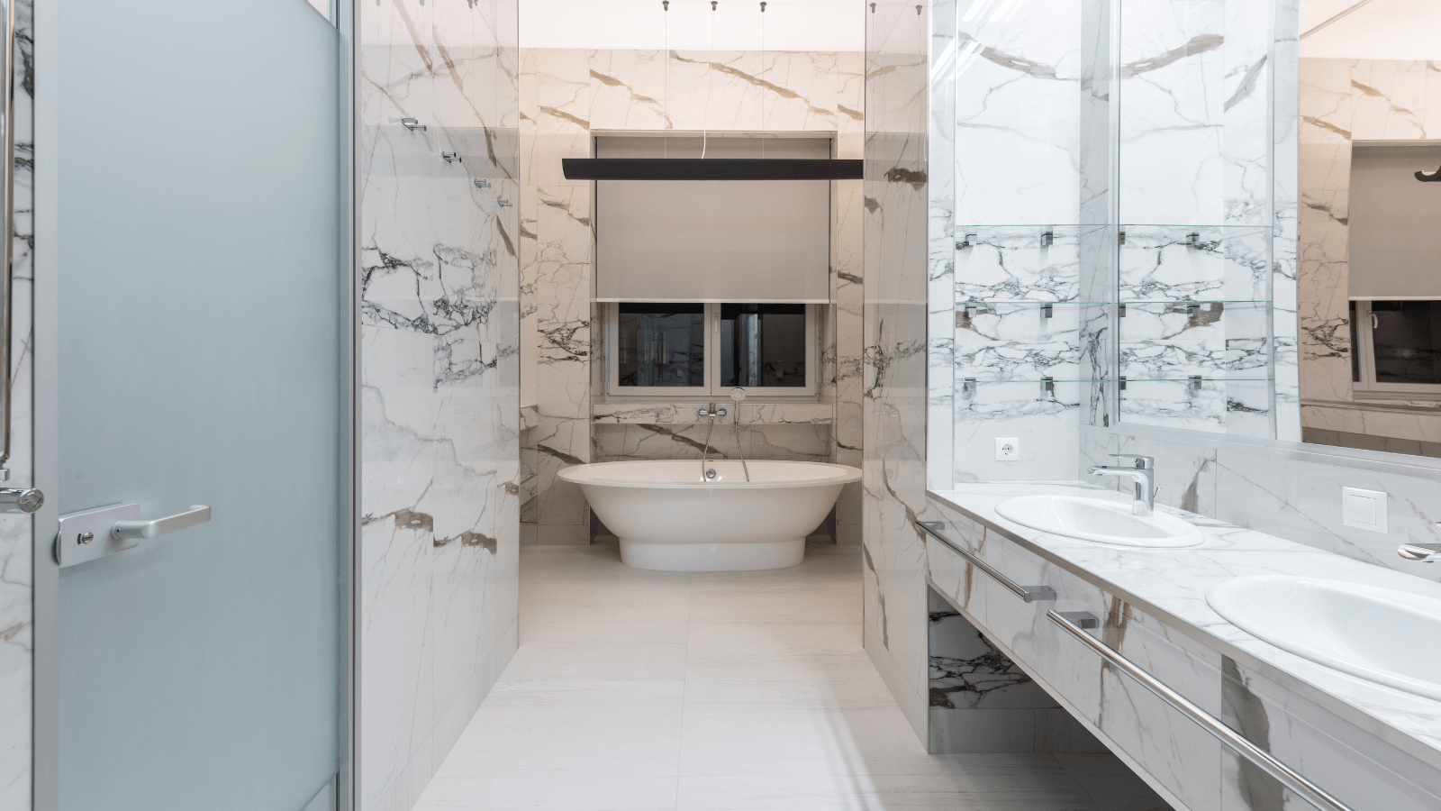 A bathroom with a bathtub , sink , mirror and shower.