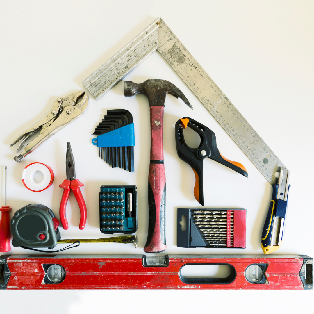 A bunch of tools arranged in the shape of a house