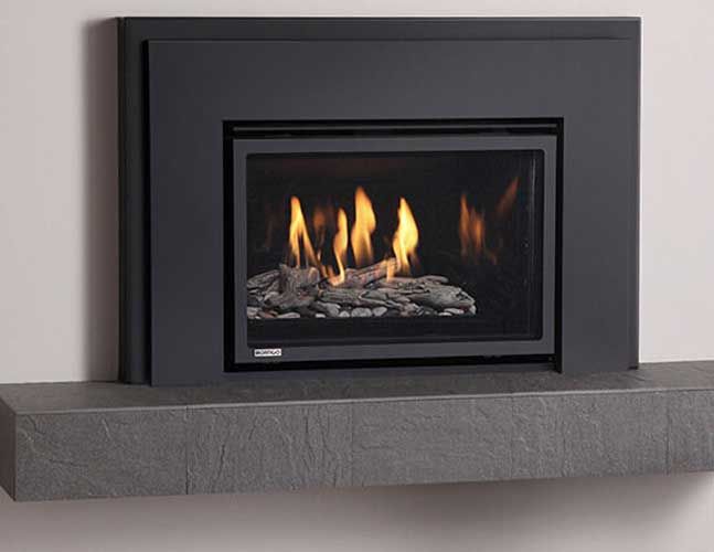 A fireplace with flames coming out of it is sitting on a mantle.