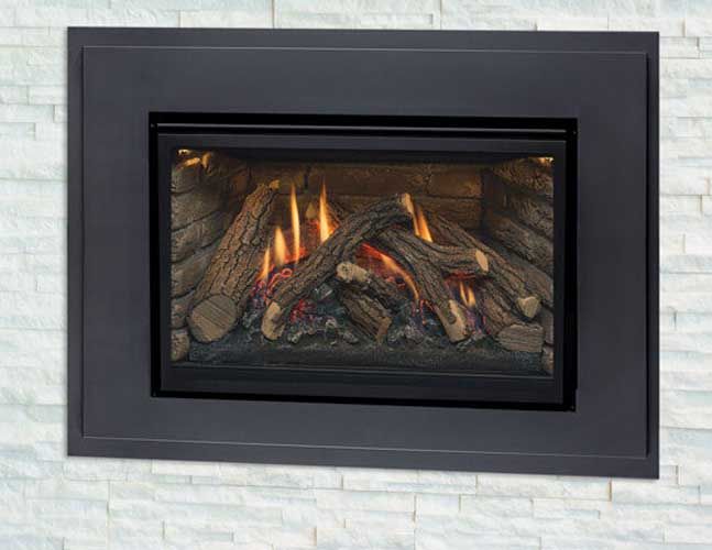 A gas fireplace is mounted on a white brick wall.