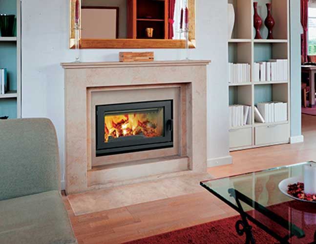 A living room with a fireplace and a glass coffee table