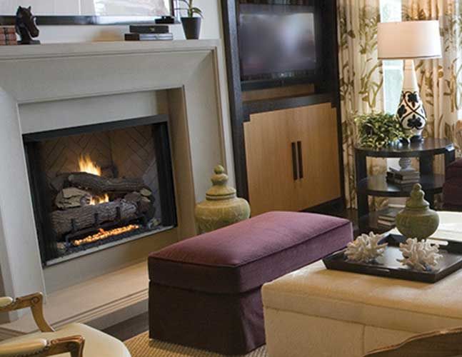 A living room with a fireplace and a television