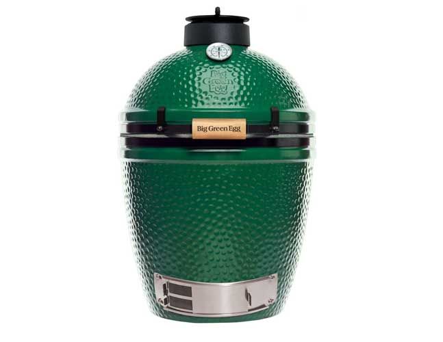 A green big green egg with a black lid on a white background