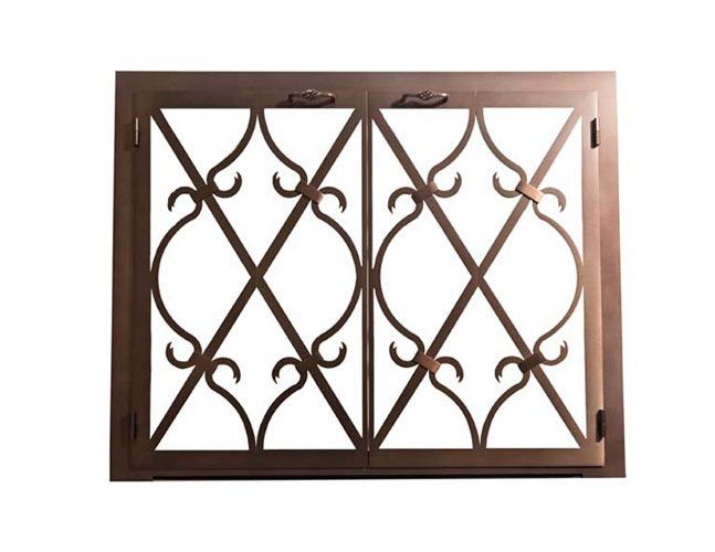 A window with a wrought iron design on it